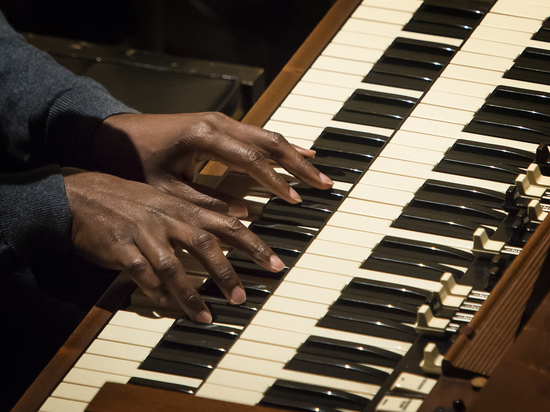 Hands on a Hammond B3 keyboard during a Gospel Ensemble concert