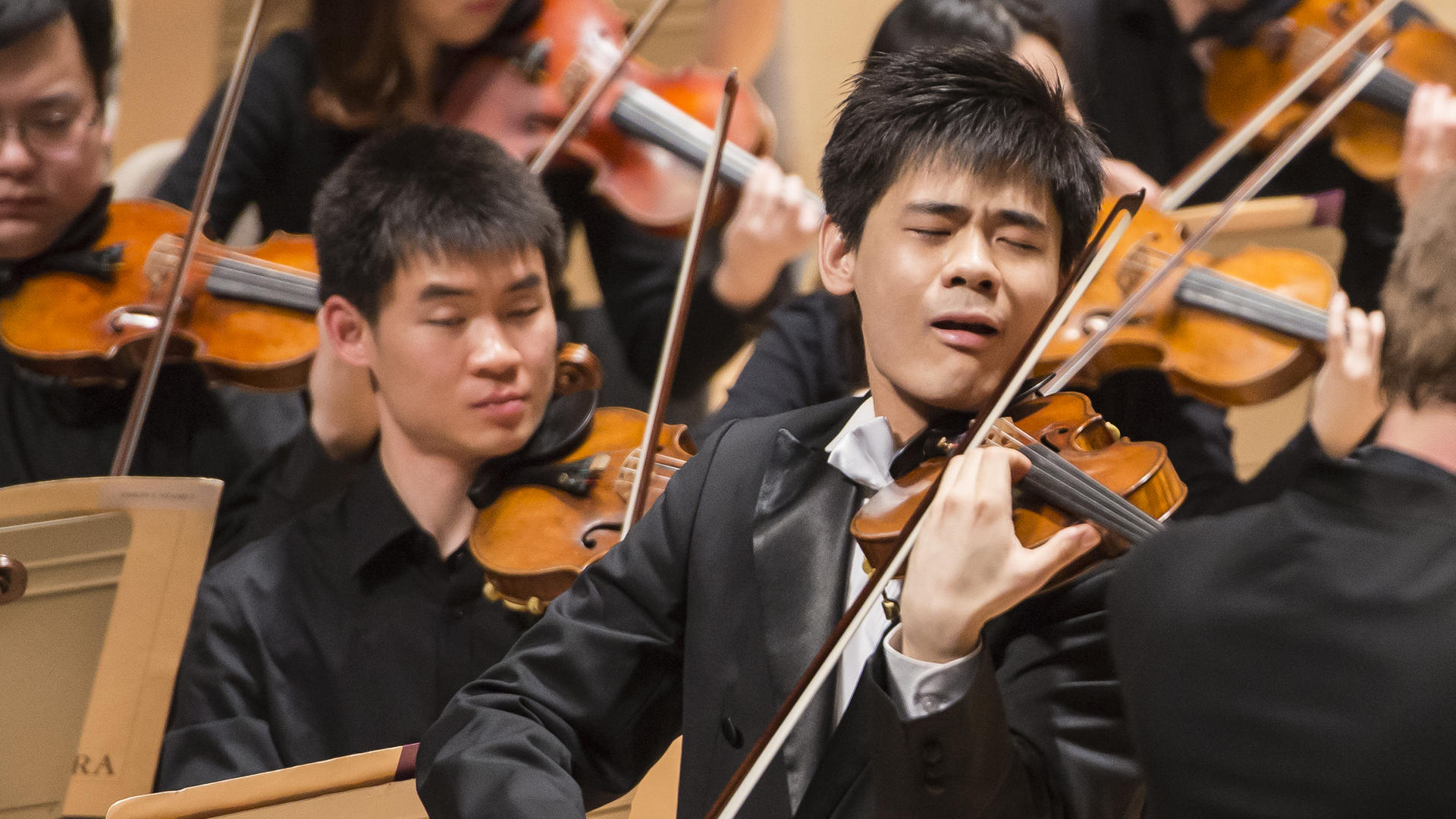 Angelo Yu performs with the NEC Philharmonia