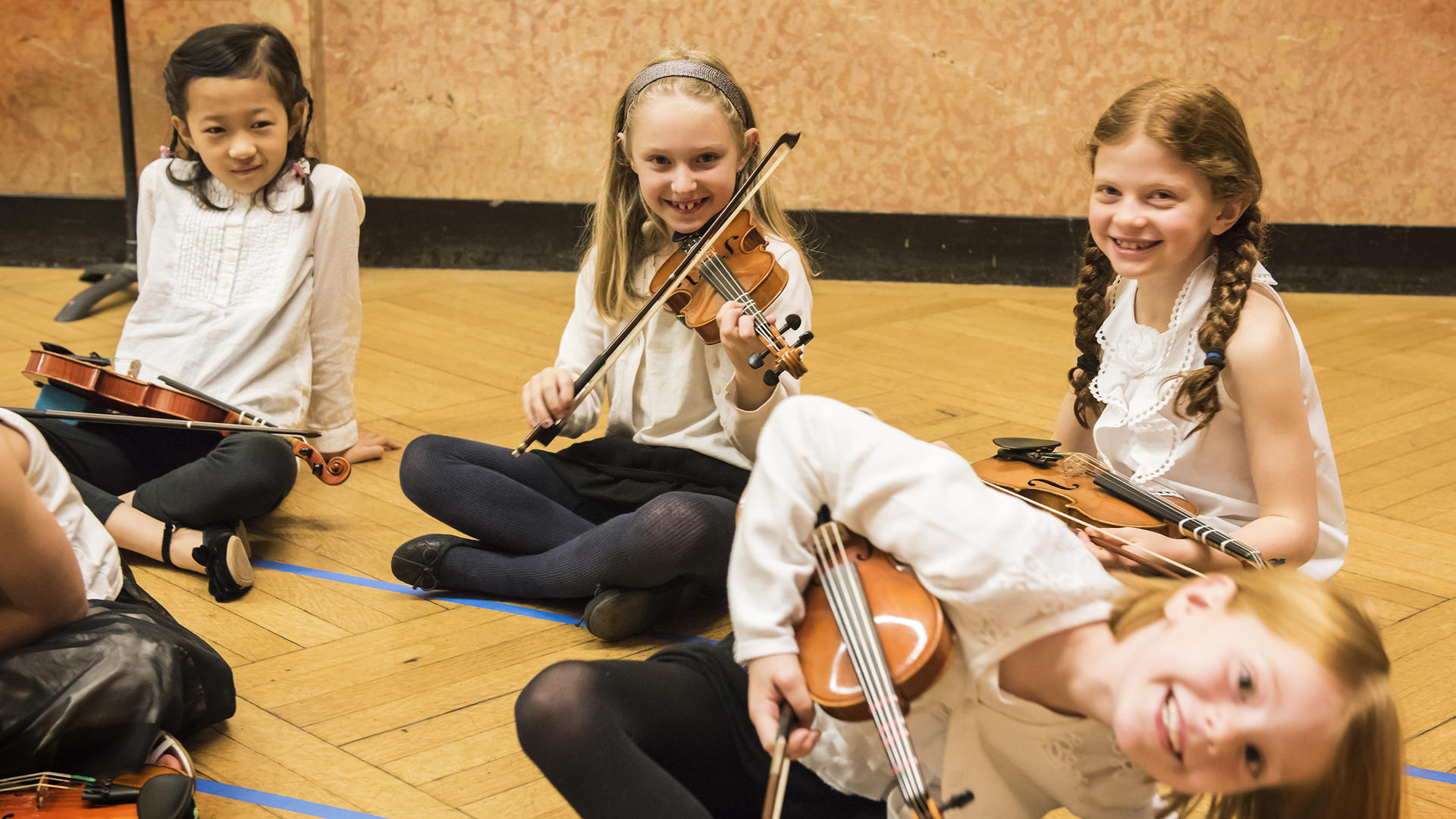 Prep Early childhood string players wait to perform