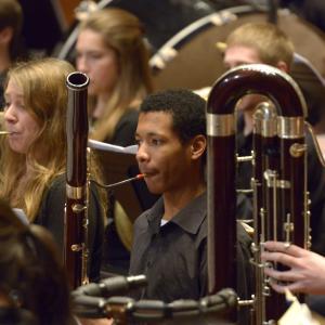 A bassoon section performs with the N E C Philharmonia