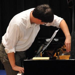 A pianist performs with NEC Shivaree