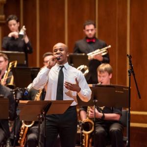 A singer performs with the NEC Jazz Orchestra